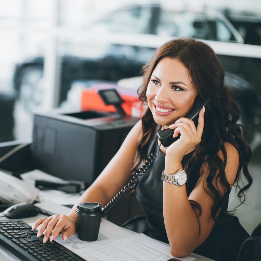 car saleswoman on the phone