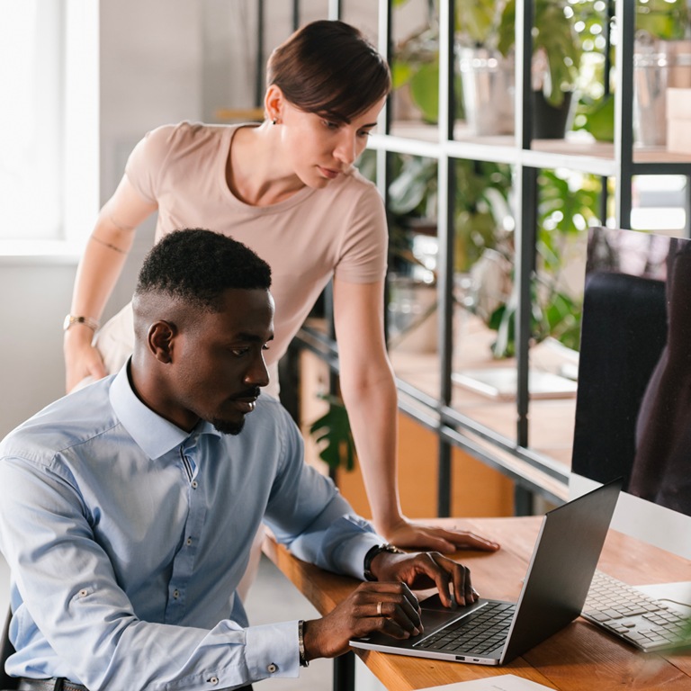  black man woman laptop plant